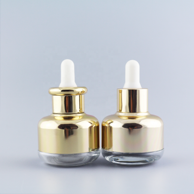 New design Luxury 30ml round shape sealable gold collar face serum glass essencial oil bottle